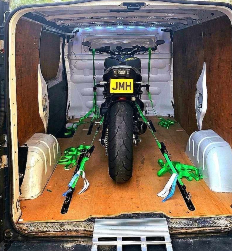 Motorcycle secured inside JMH transport van