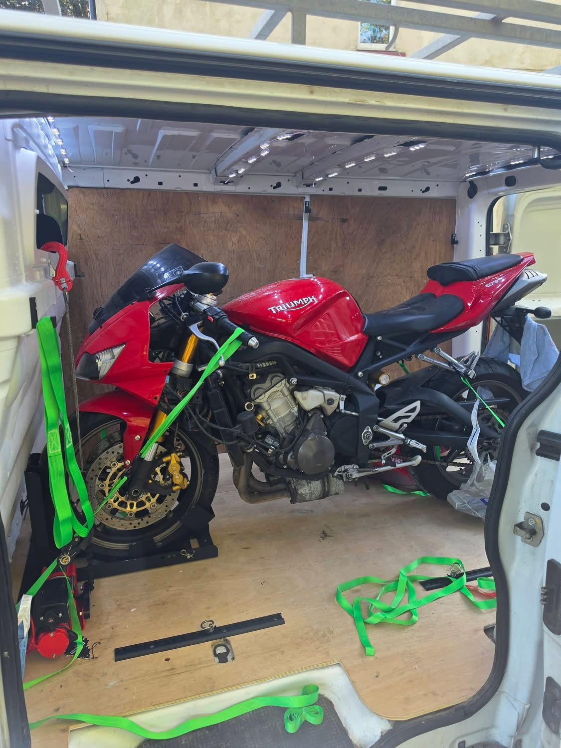 Motorcycle being transported by JMH